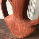 Vase in carved teak wood, 60s