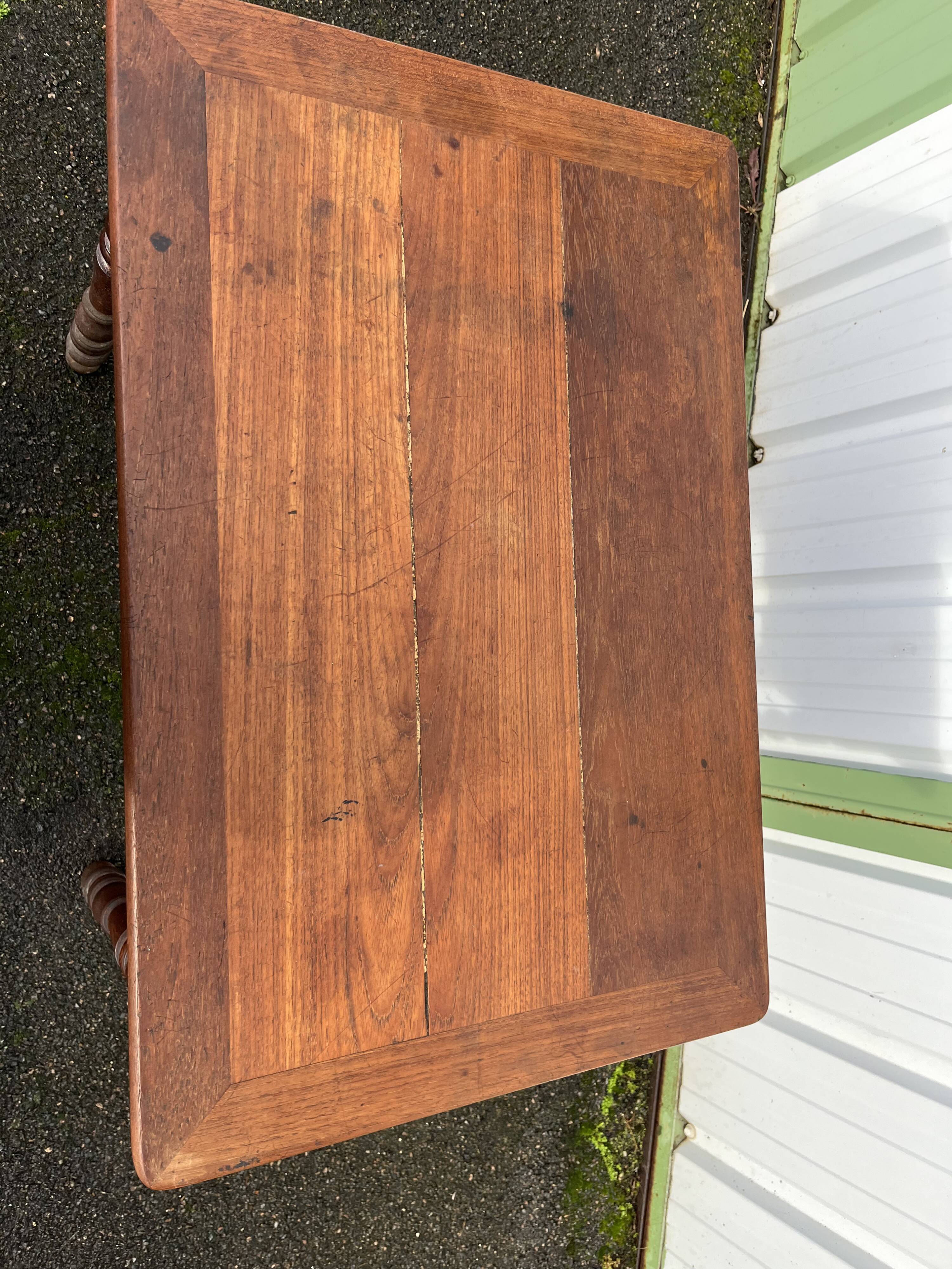 Wooden side table with turned legs