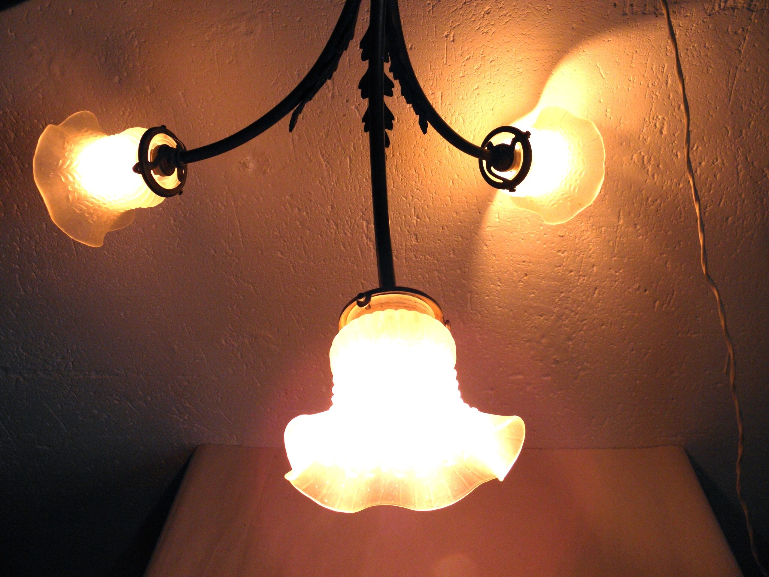 Three-spoke brass and glass chandelier