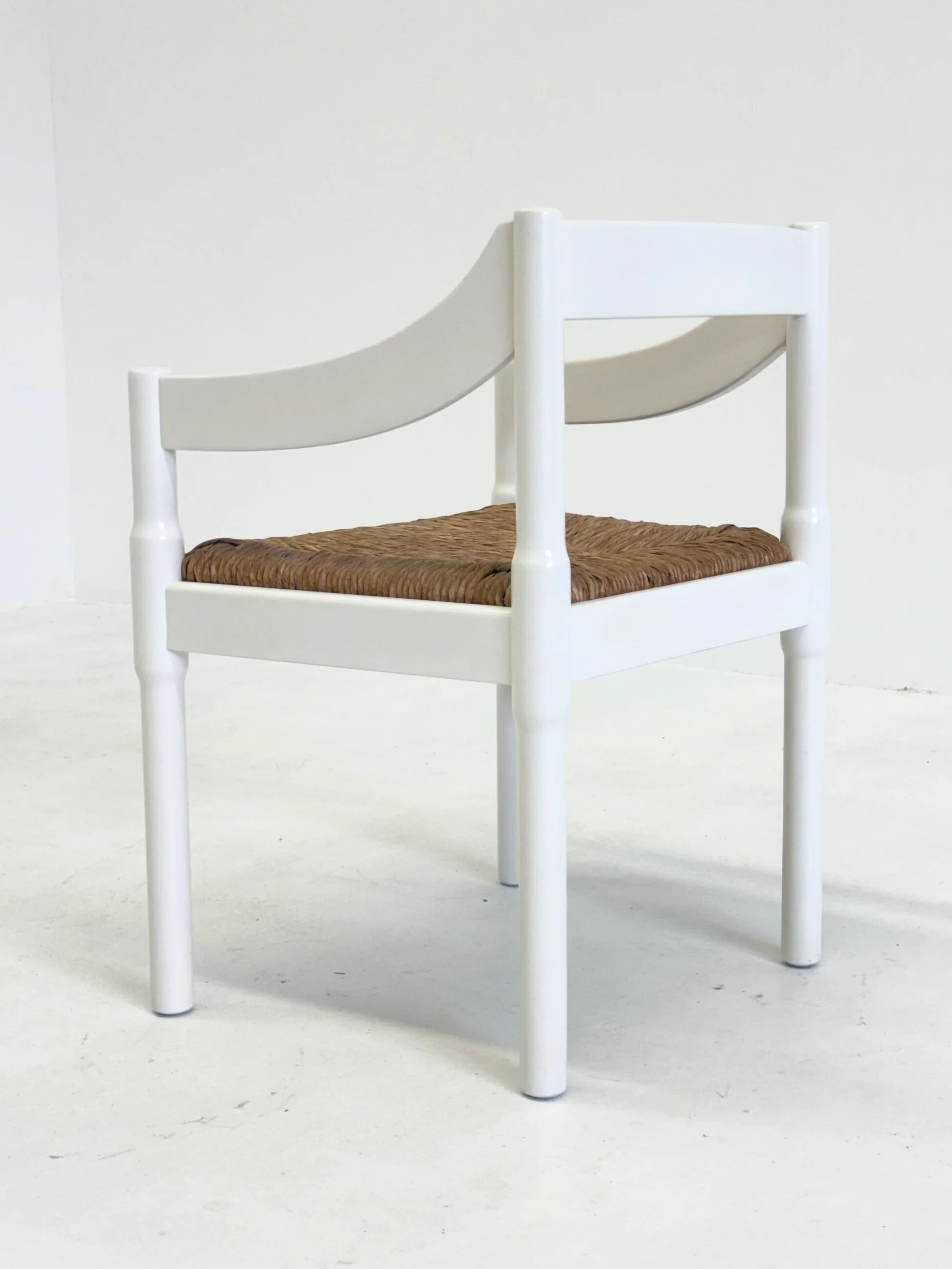 Set of two Carimate chairs by Vico Magistretti in white