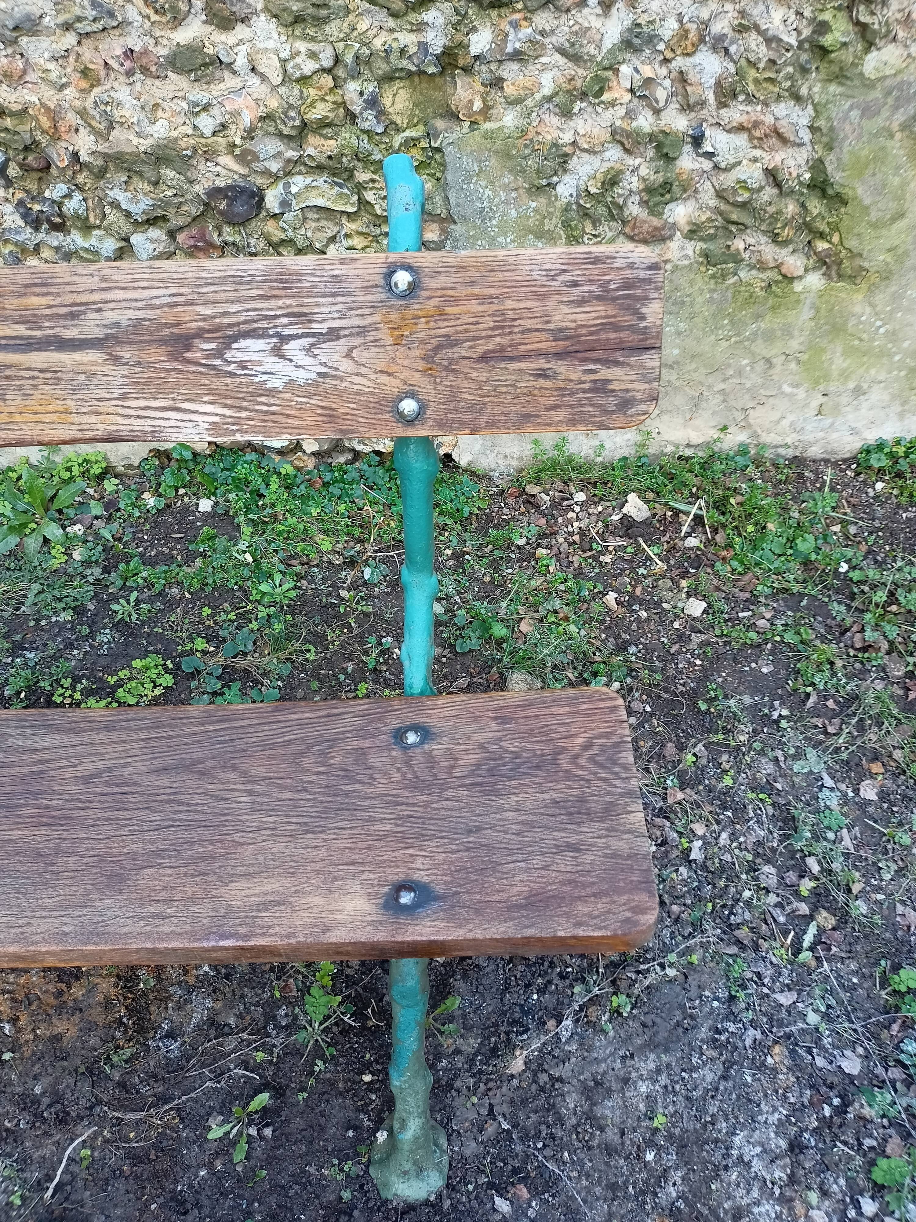 Green wood cast iron garden bench