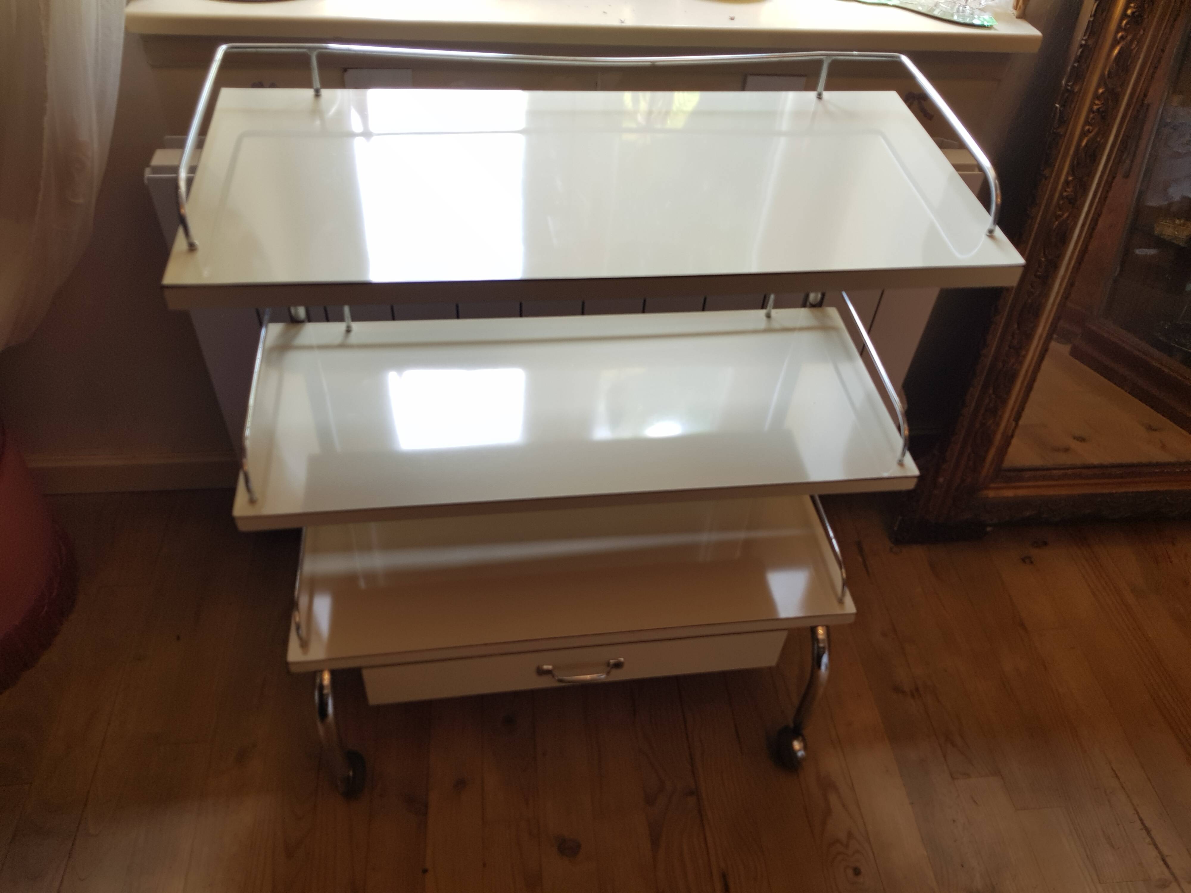 Rolling serving table with drawer
