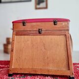 Old fisherman's stool with red seat