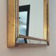 Miroir doré à  parcloses Deknudt des années 70