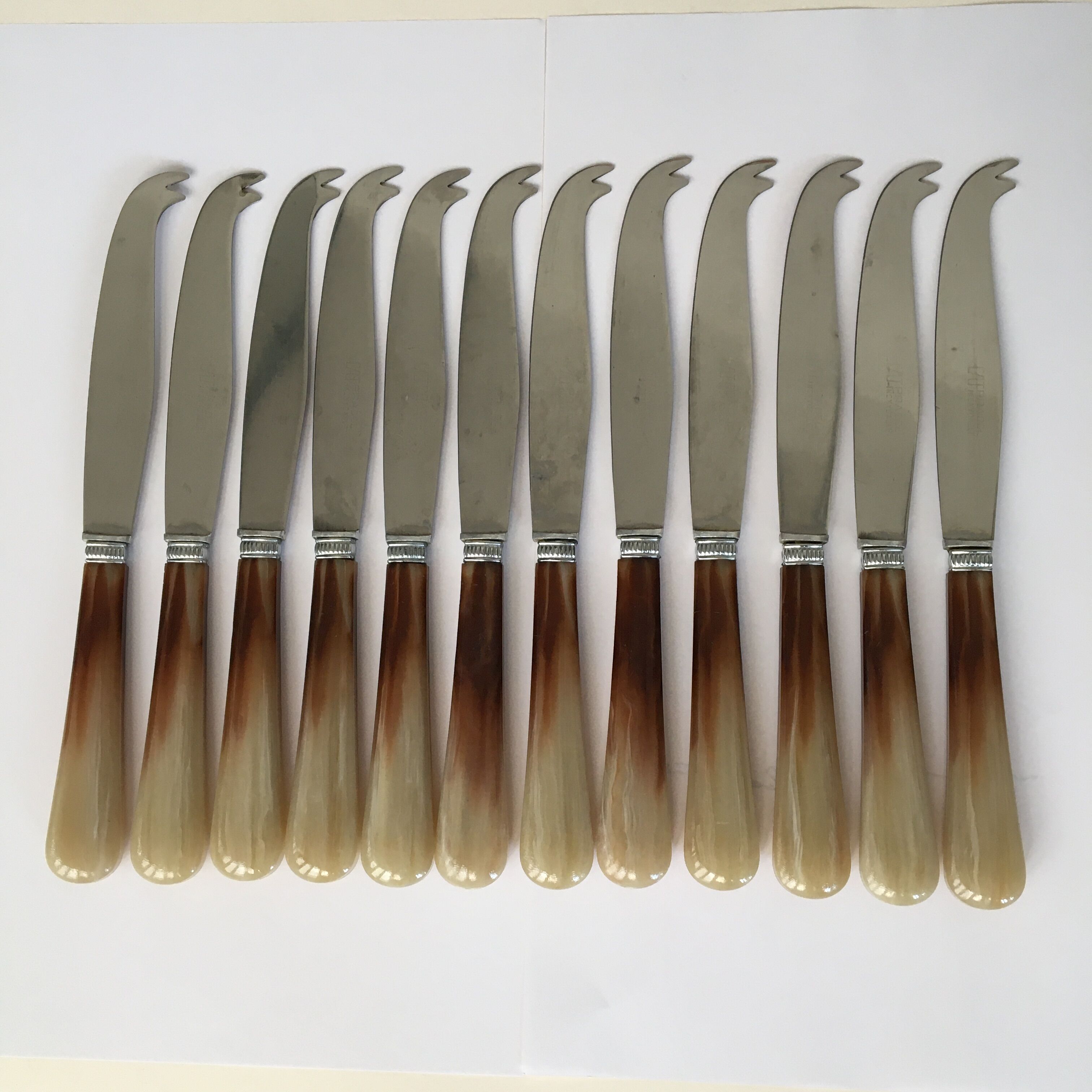 Set of 12 Pradel cheese knives