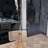 Bottle surrounded wicker