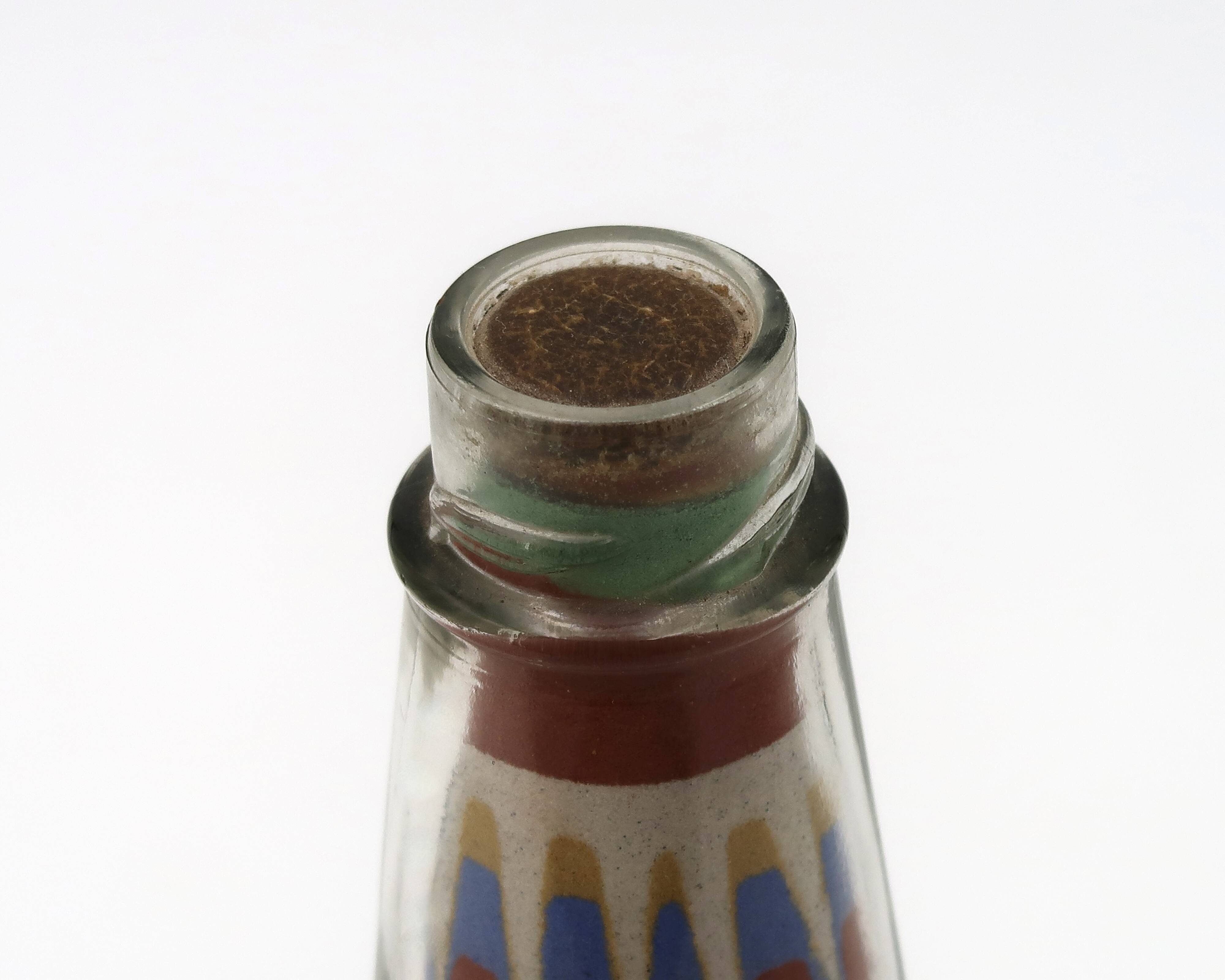 Glass bottle with coloured sand, South America 1970s
