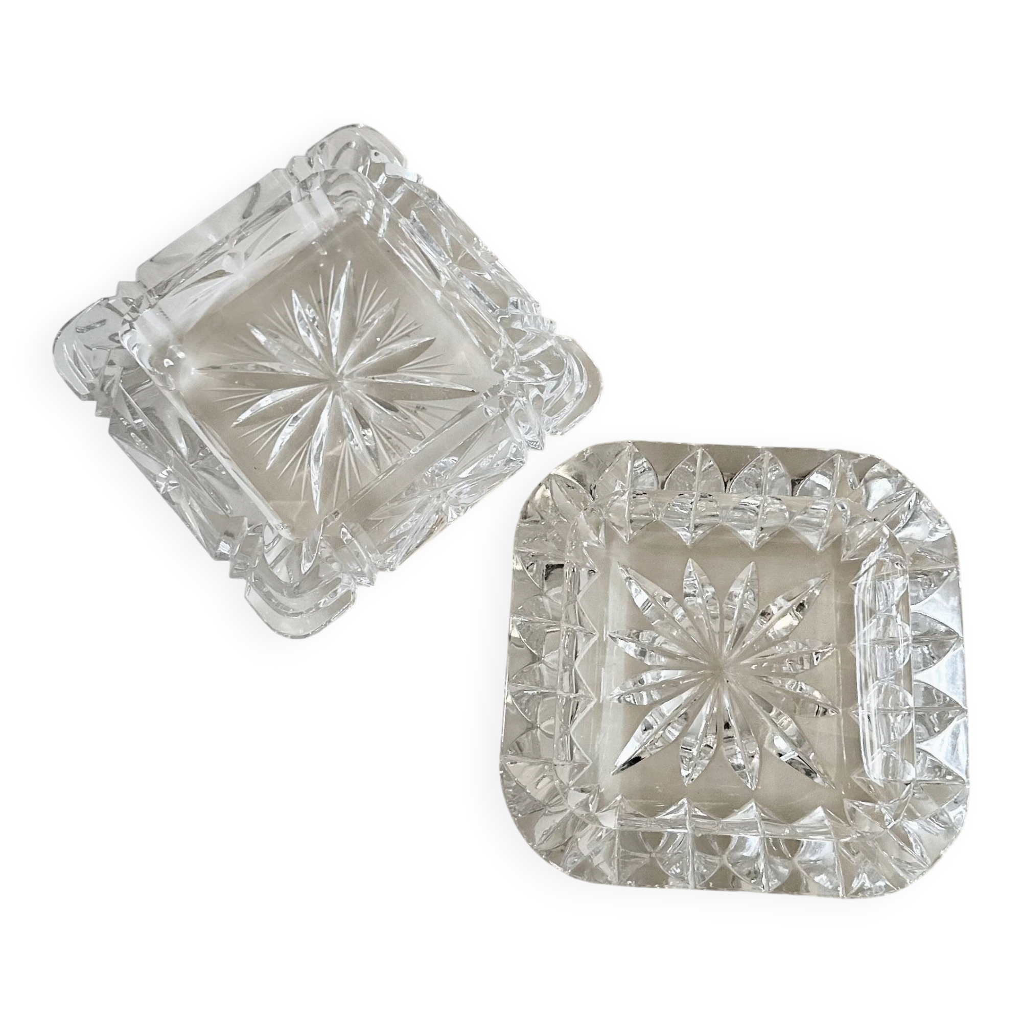 A pair of crystal ashtrays.