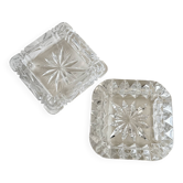 A pair of crystal ashtrays.