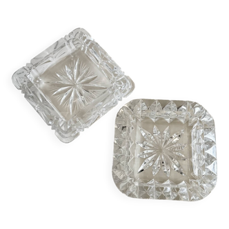 A pair of crystal ashtrays.