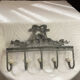 Patinated metal wall bracket and porcelain
