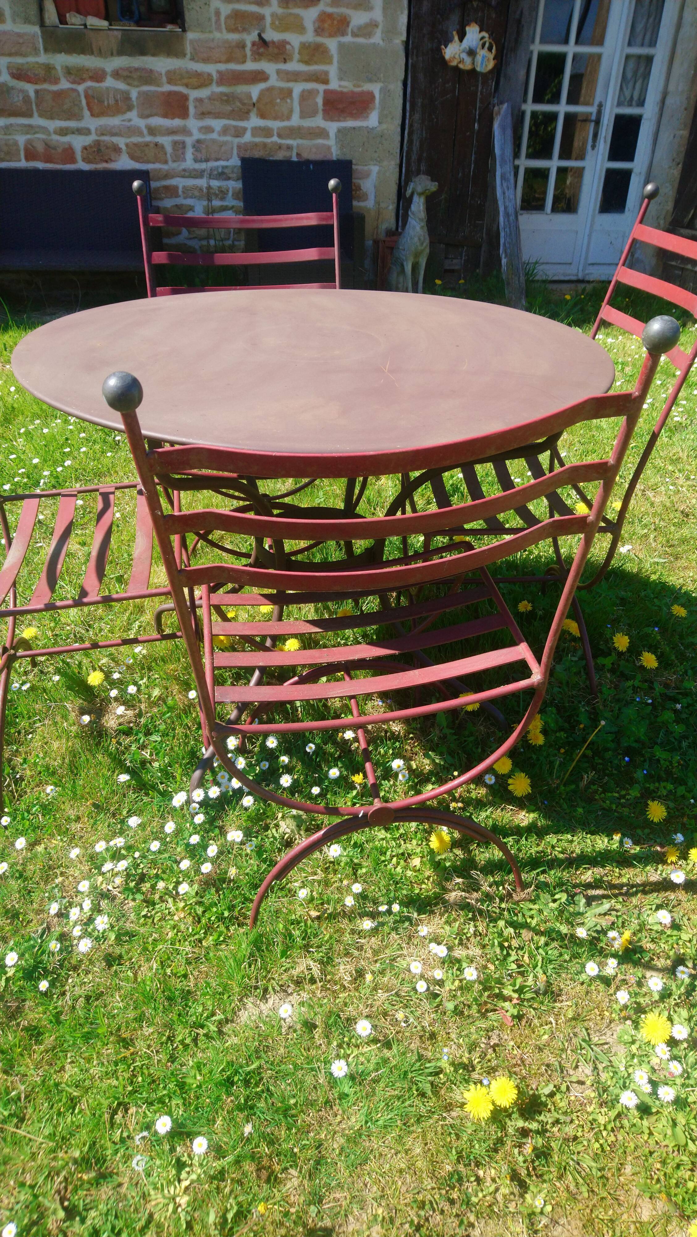 Garden table + 4 wrought iron chairs