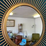 Sun mirror in gilded metal