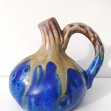 Vintage decanter in enamelled earthenware