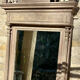 Imposing fireplace mirror in carved and painted wood, 19th century.