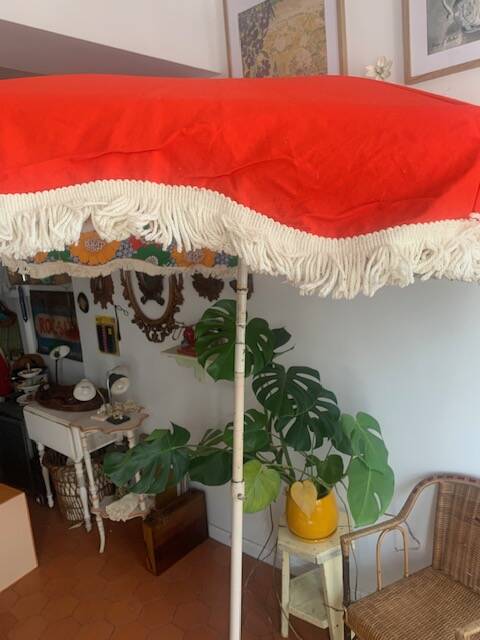 Large floral tilting beach umbrella with cotton fringes, 1960