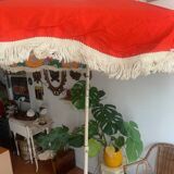 Large floral tilting beach umbrella with cotton fringes, 1960