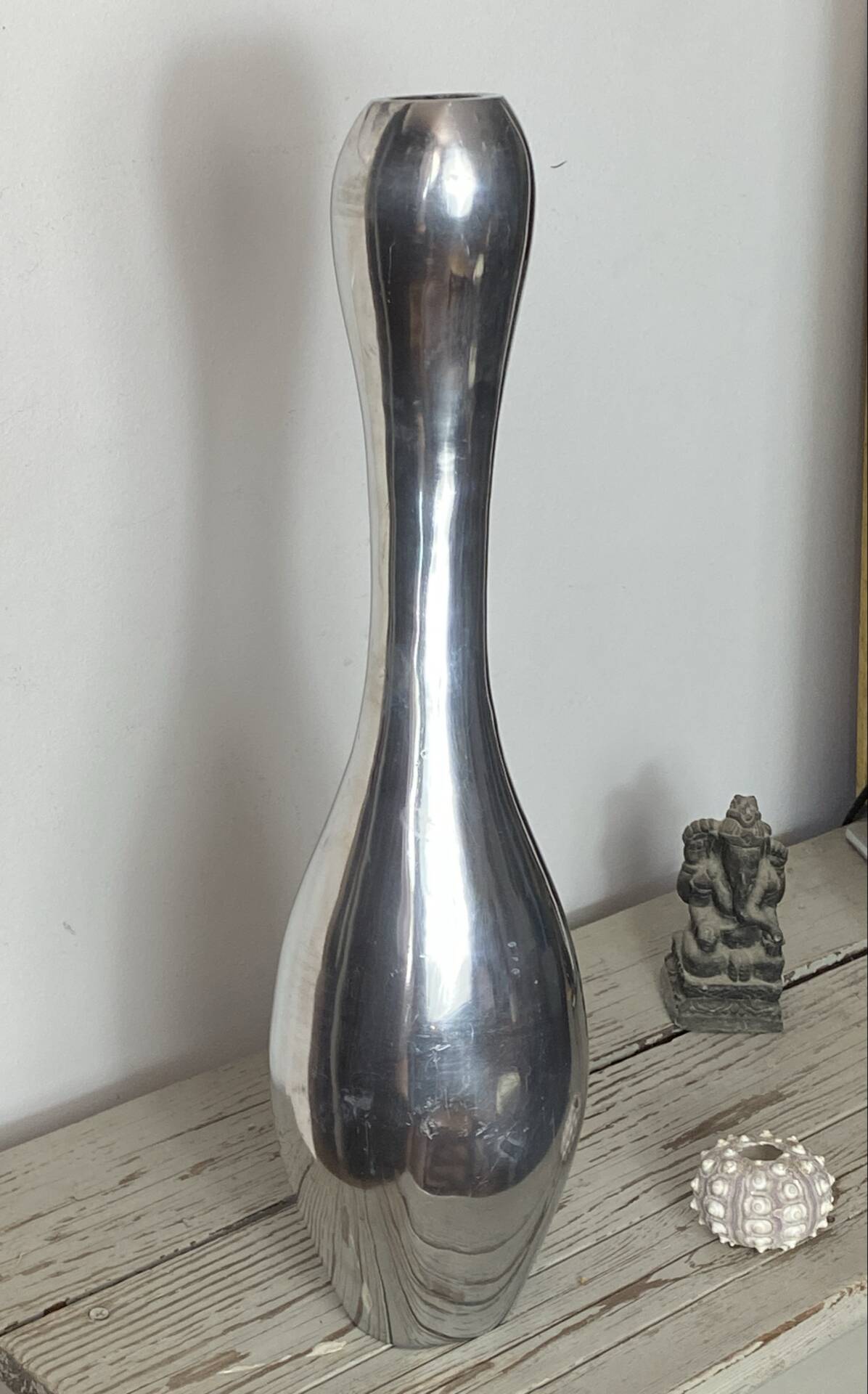 Large organic vase in polished aluminium cast.
