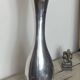 Large organic vase in polished aluminium cast.