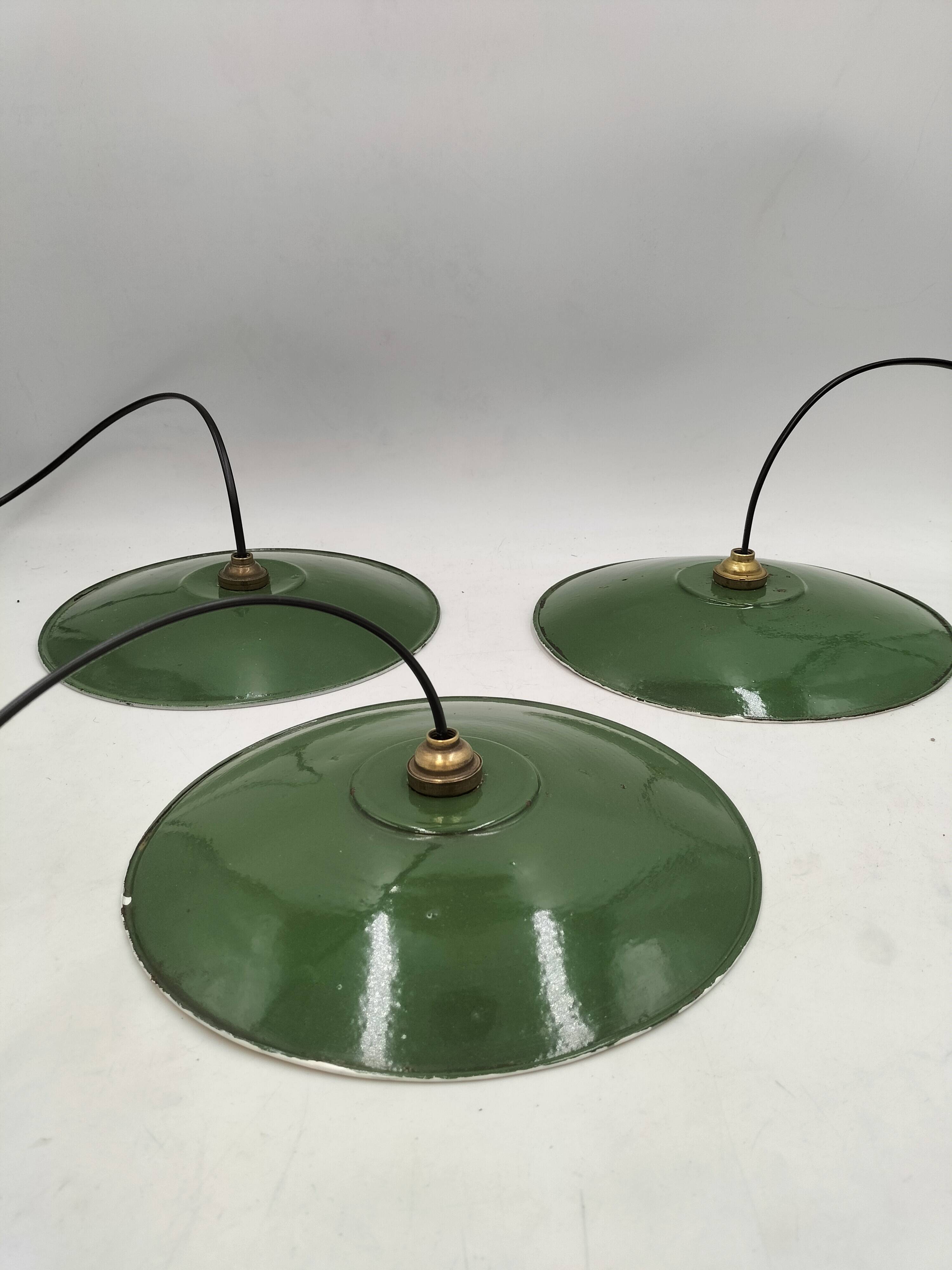 Three enamelled sheet metal suspensions
