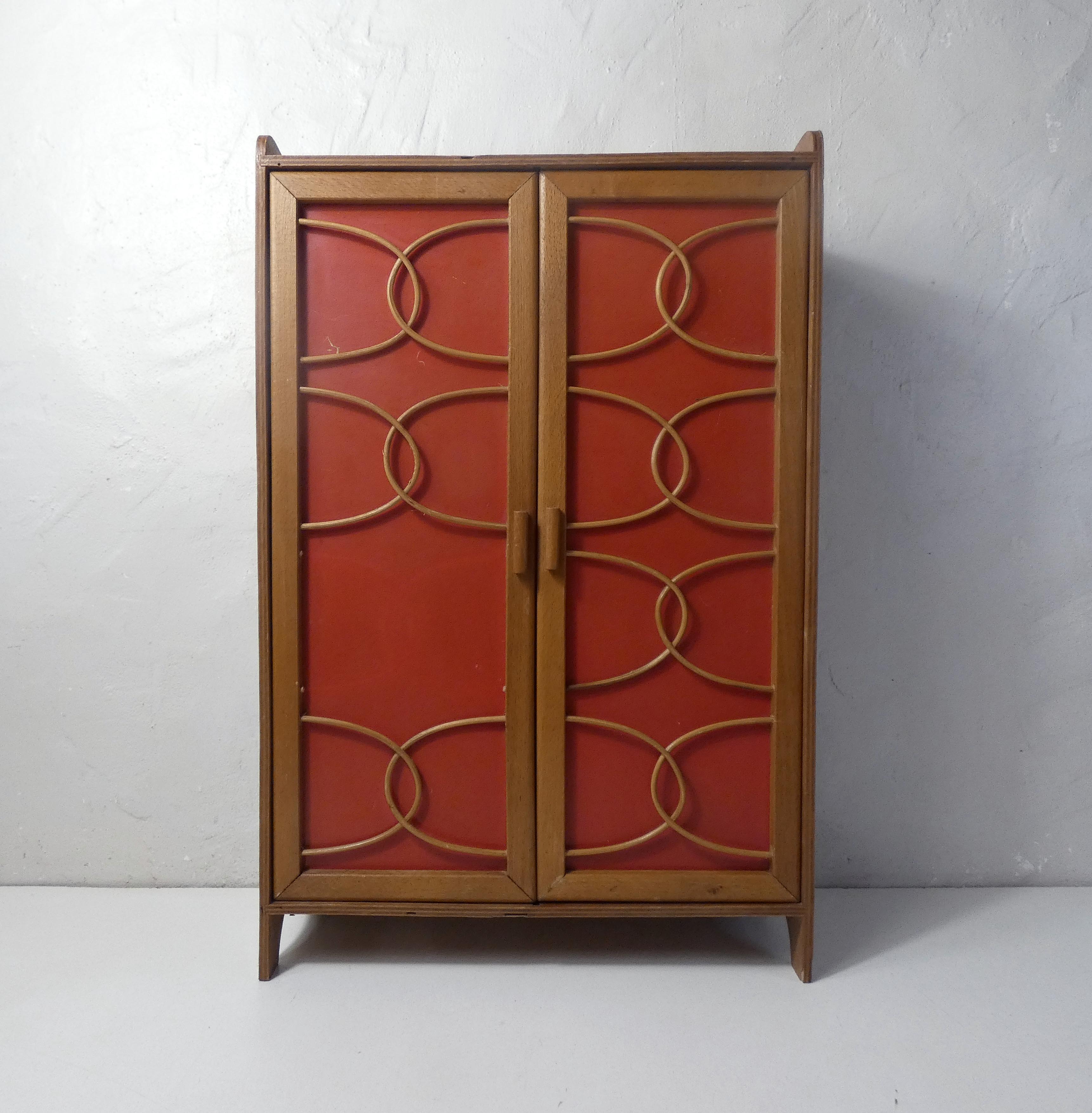 Rattan doll cabinet