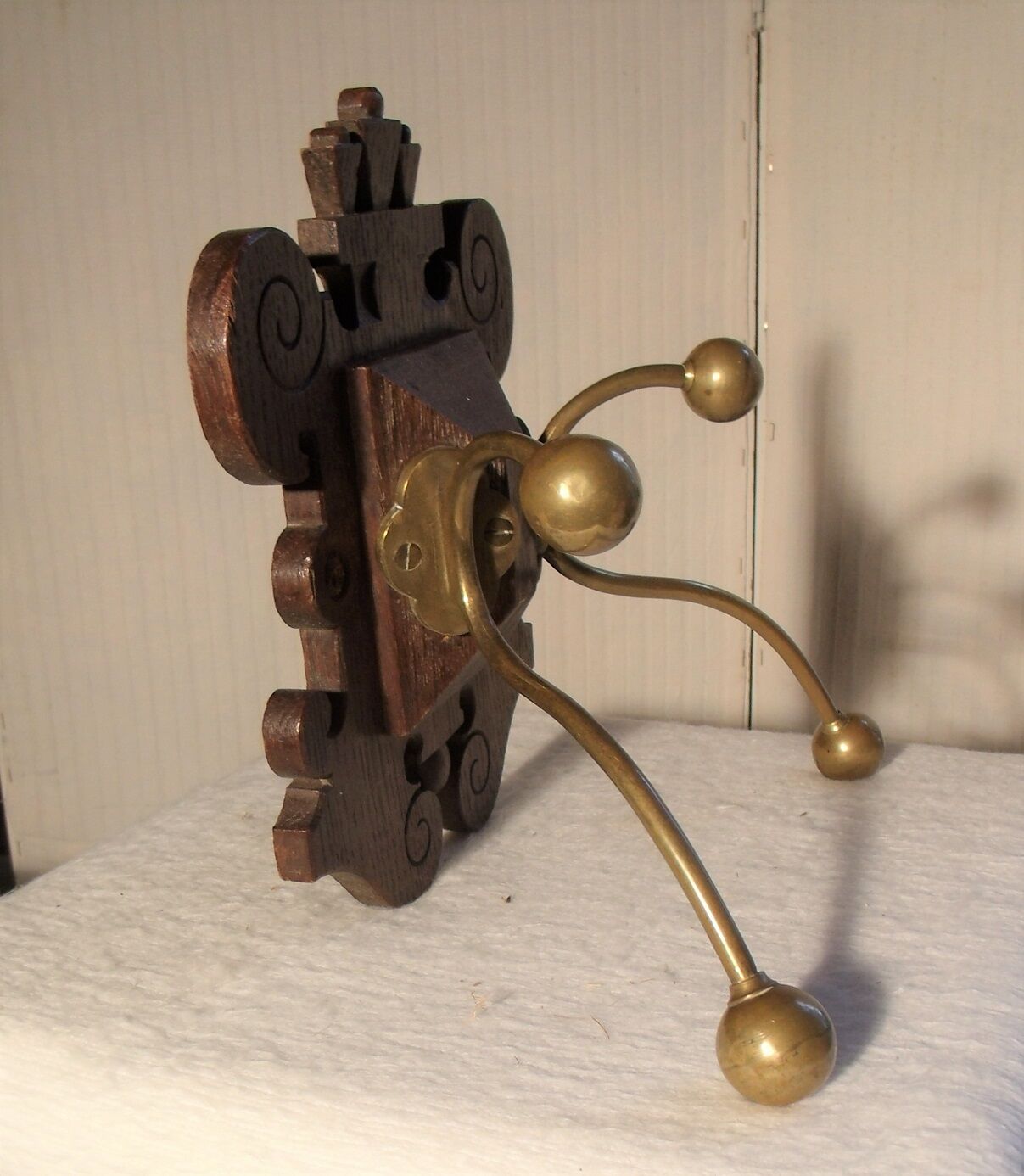 Former wooden and brass wall coat racks