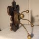 Former wooden and brass wall coat racks
