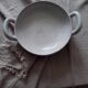 Cracked plate from the 19th century with handles.