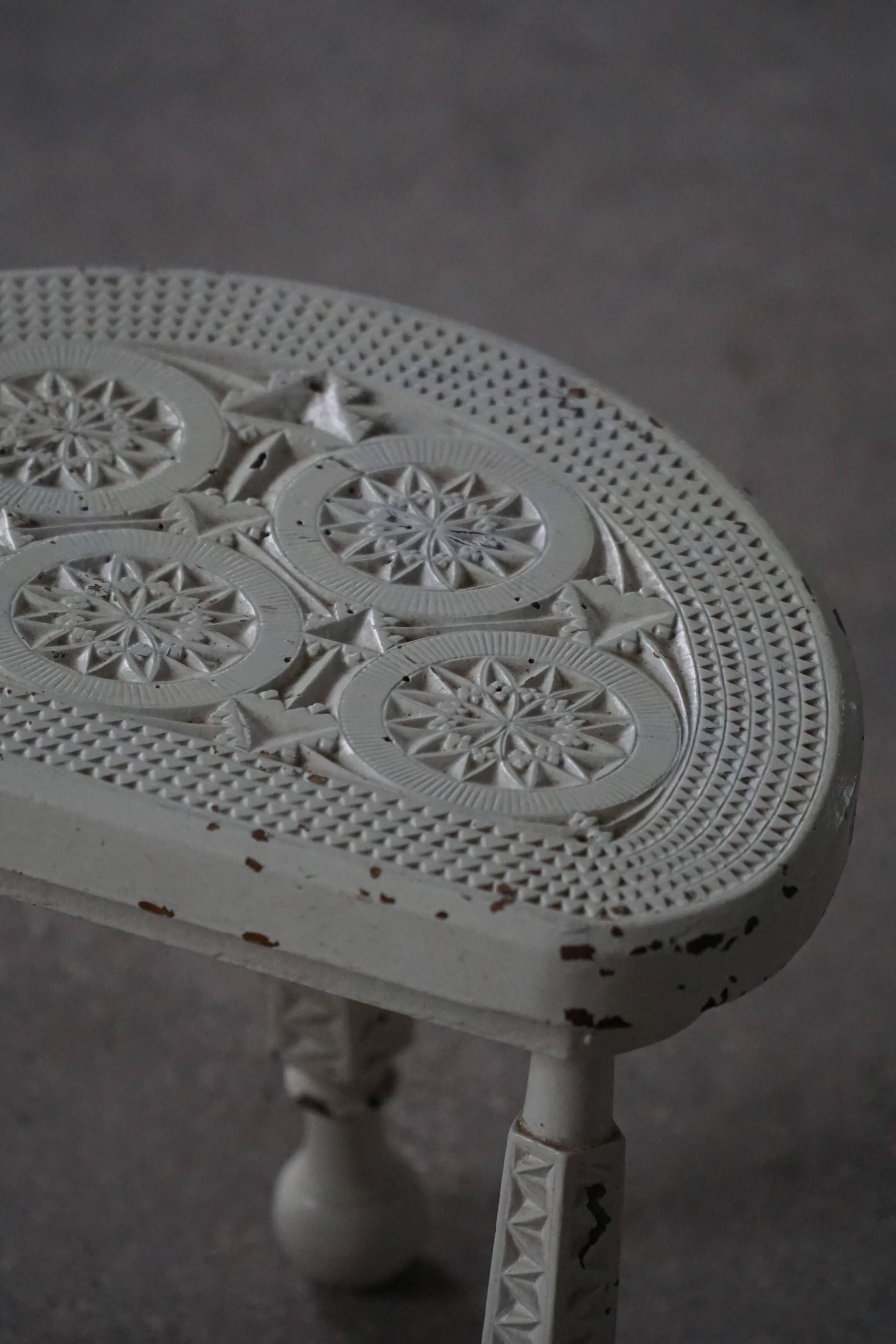 Tripod wooden stool with carved details, early 20th century Danish, 1930s.