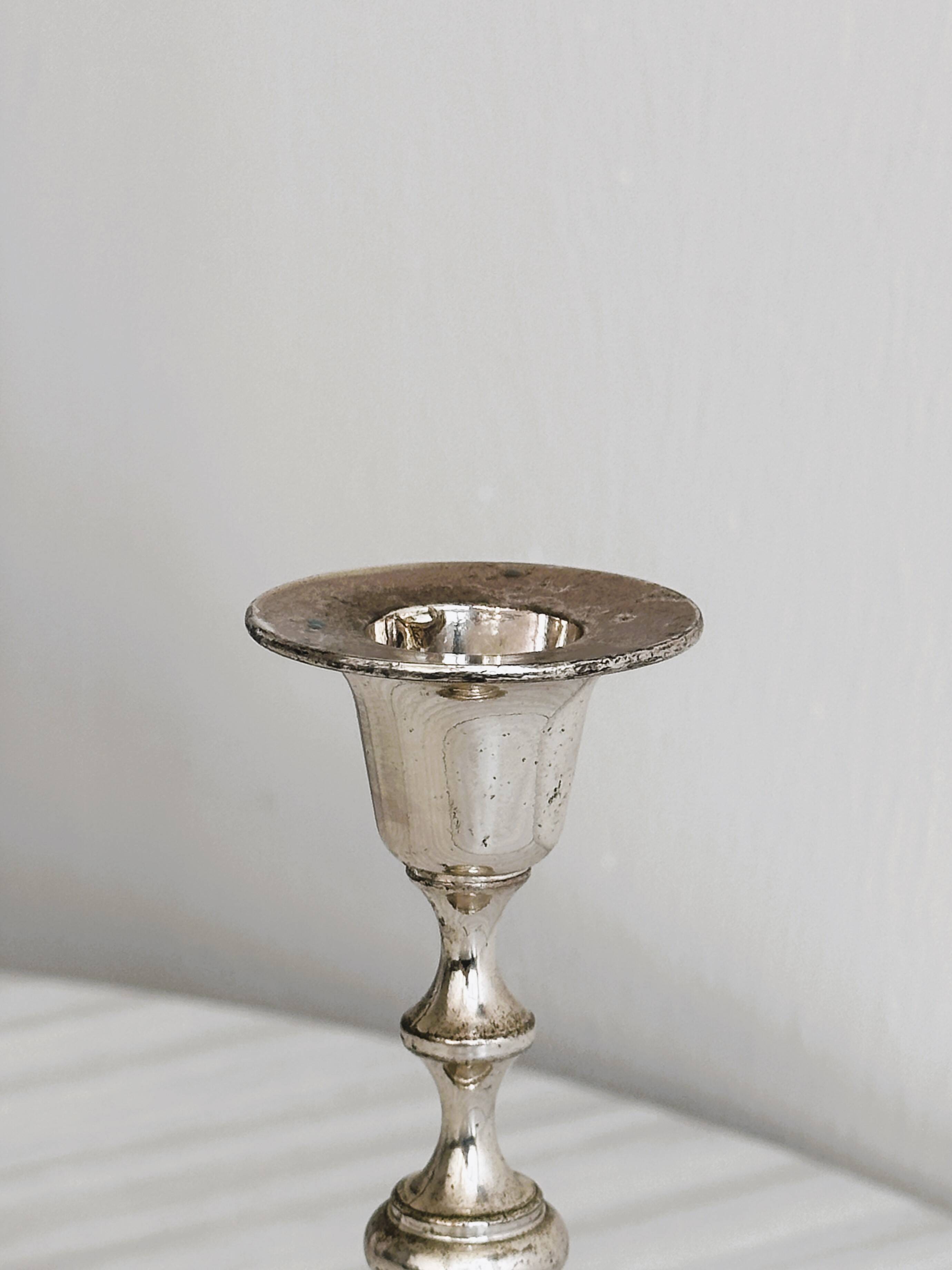 Small patinated candle holder.