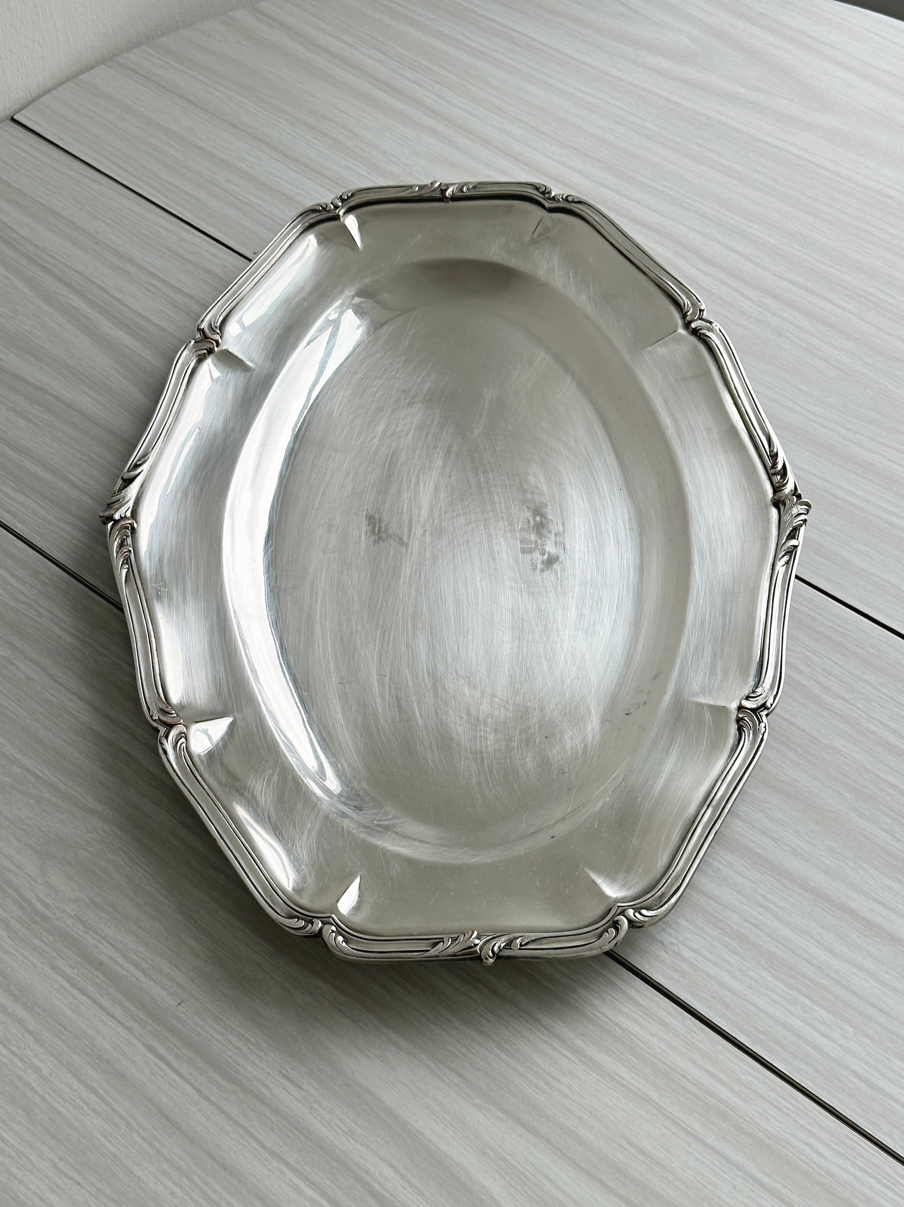 oval silver metal plate