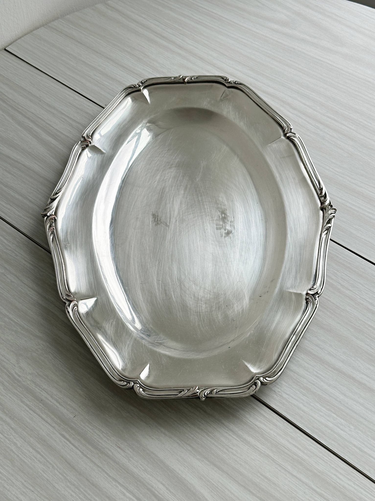 oval silver metal plate
