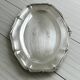 oval silver metal plate