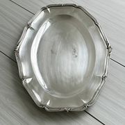 oval silver metal plate