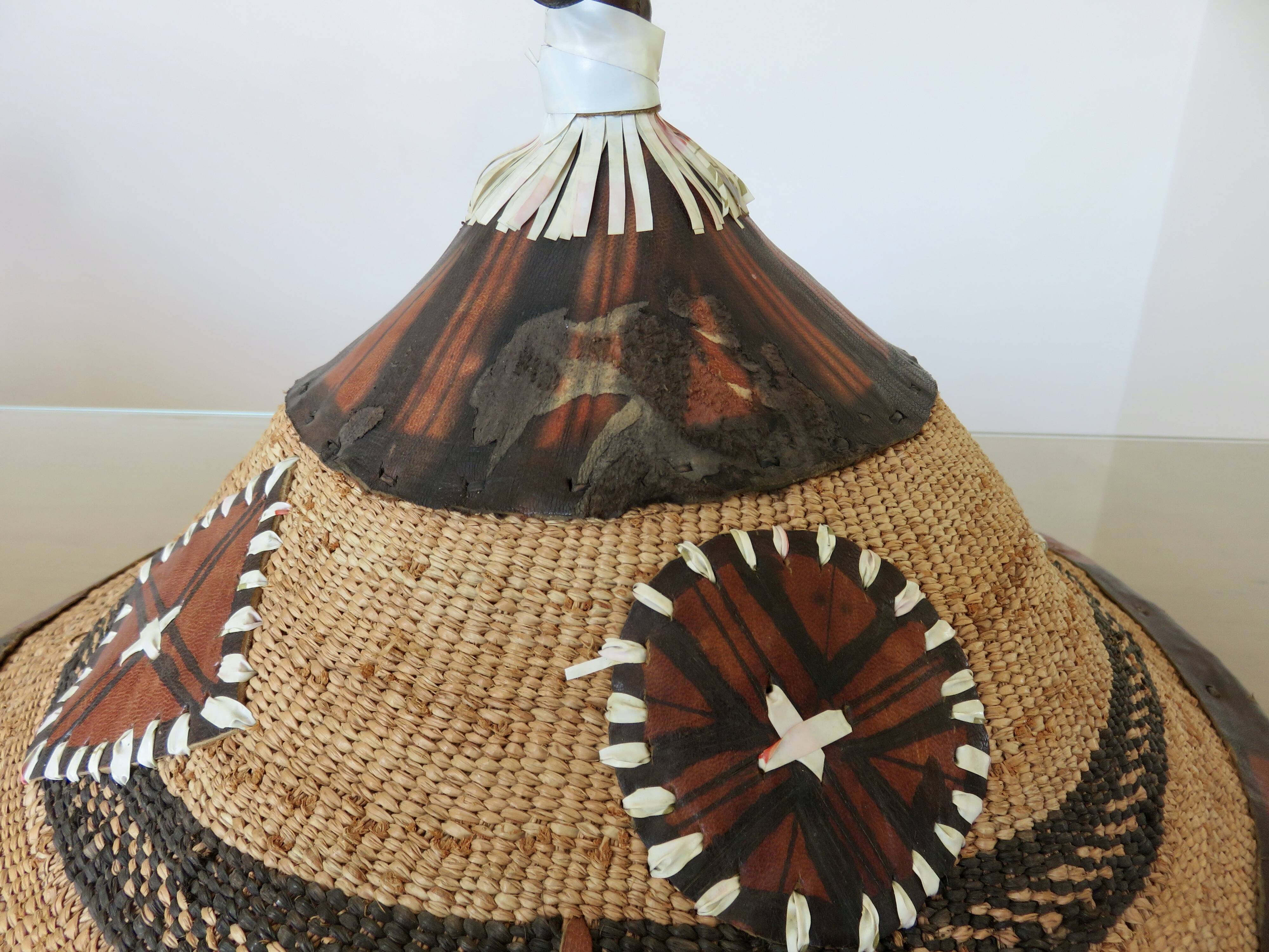 African conical hat, Fulani, in leather and braided rope, 1900, wall decoration