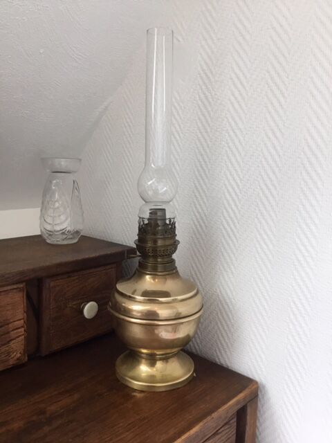 Old-fashioned brass standing oil lamp