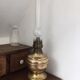 Old-fashioned brass standing oil lamp