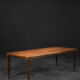 Classic vintage mid-century Scandinavian rosewood coffee table with a sliding black top.