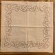 Set white tablecloth and 12 matching towels, hand embroidered