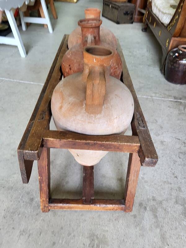 Old wooden jar holder with 3 clay jars
