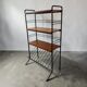 Vintage black shelf/coat rack with wooden accents.