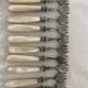12 dessert forks in steel and mother-of-pearl