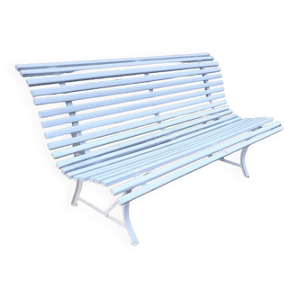 Old garden bench with metal legs and wooden slats