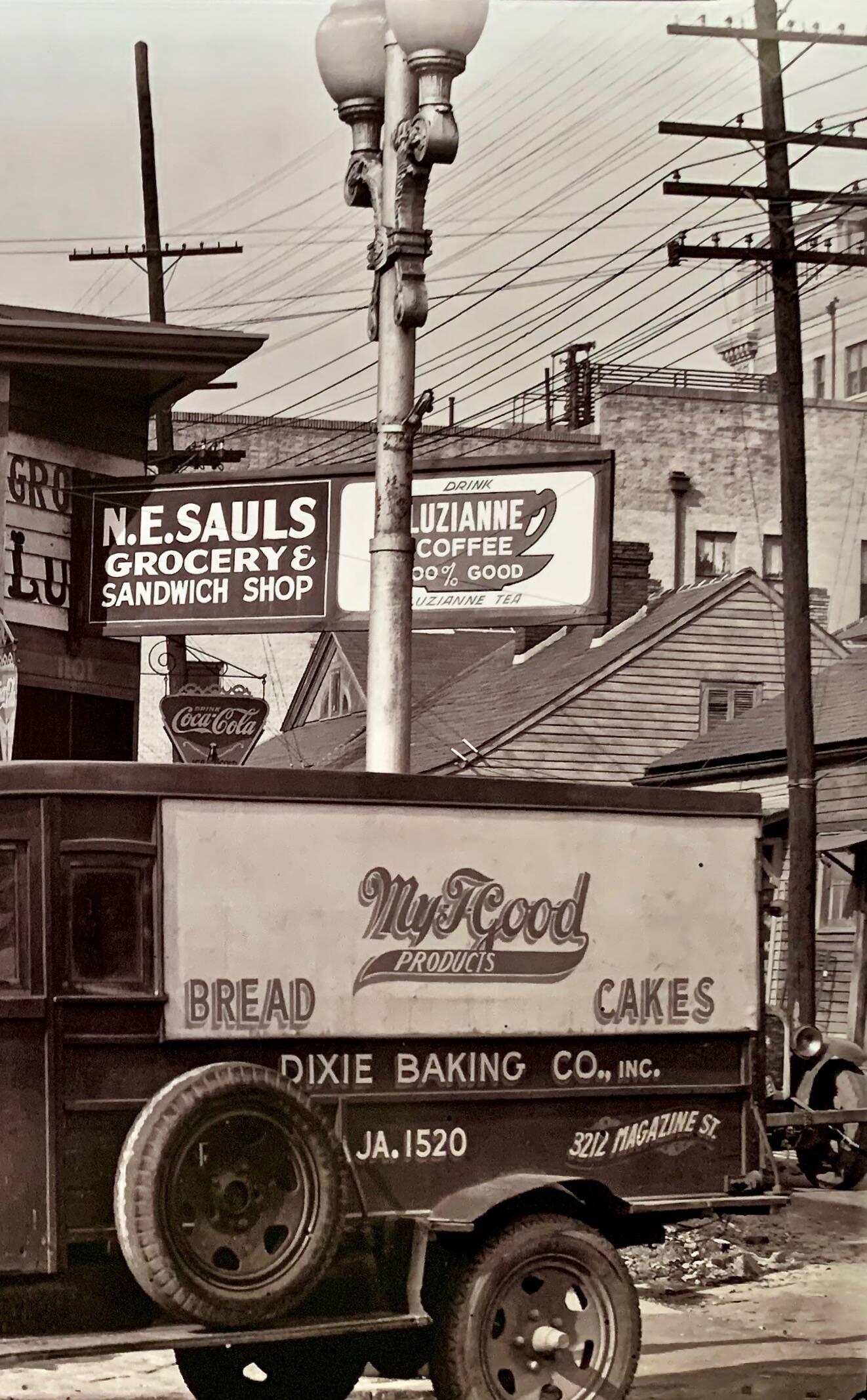 "Street corner in New Orleans, front of the NE Saul' sandwich shop