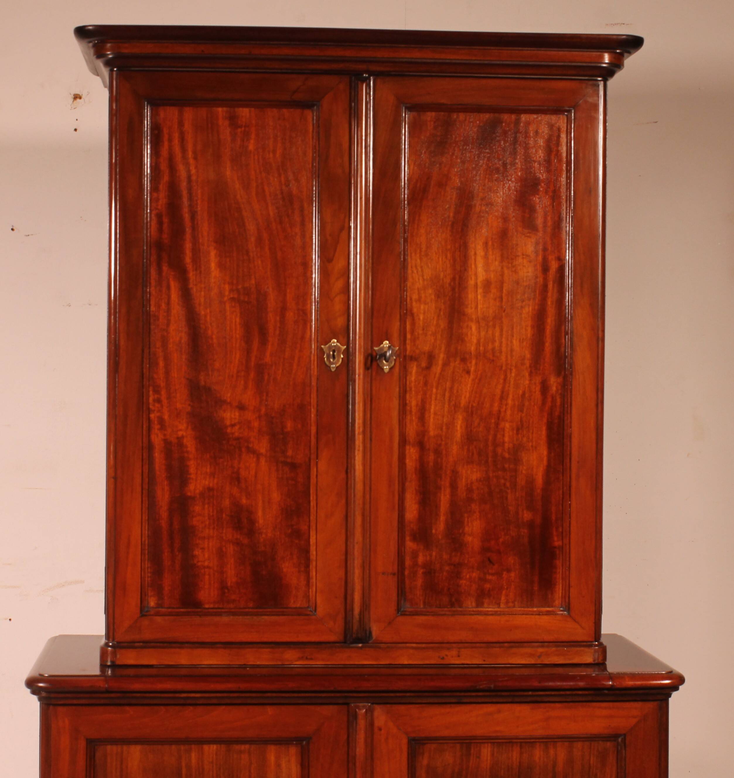 small two-body solid mahogany desk from the early 19th century with writing surface