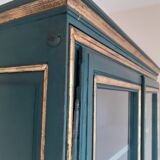 Glass cabinet in green patinated wood
