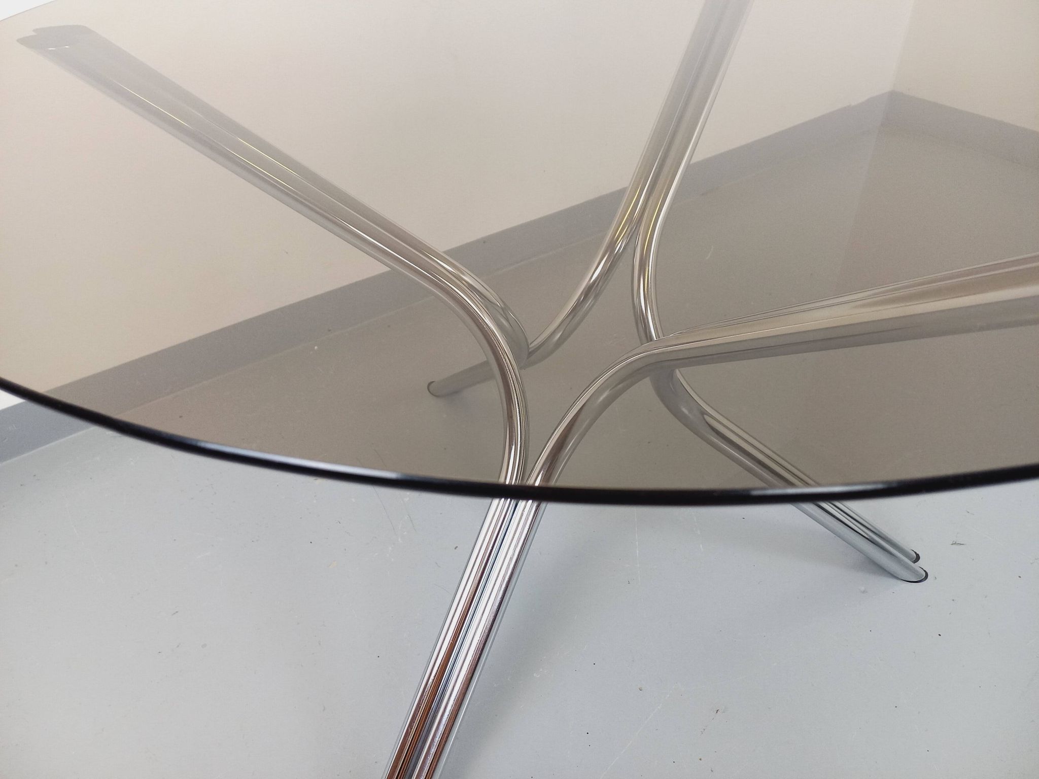 Vintage round dining table in smoked glass and chromed metal, Space Age style, from the 70s