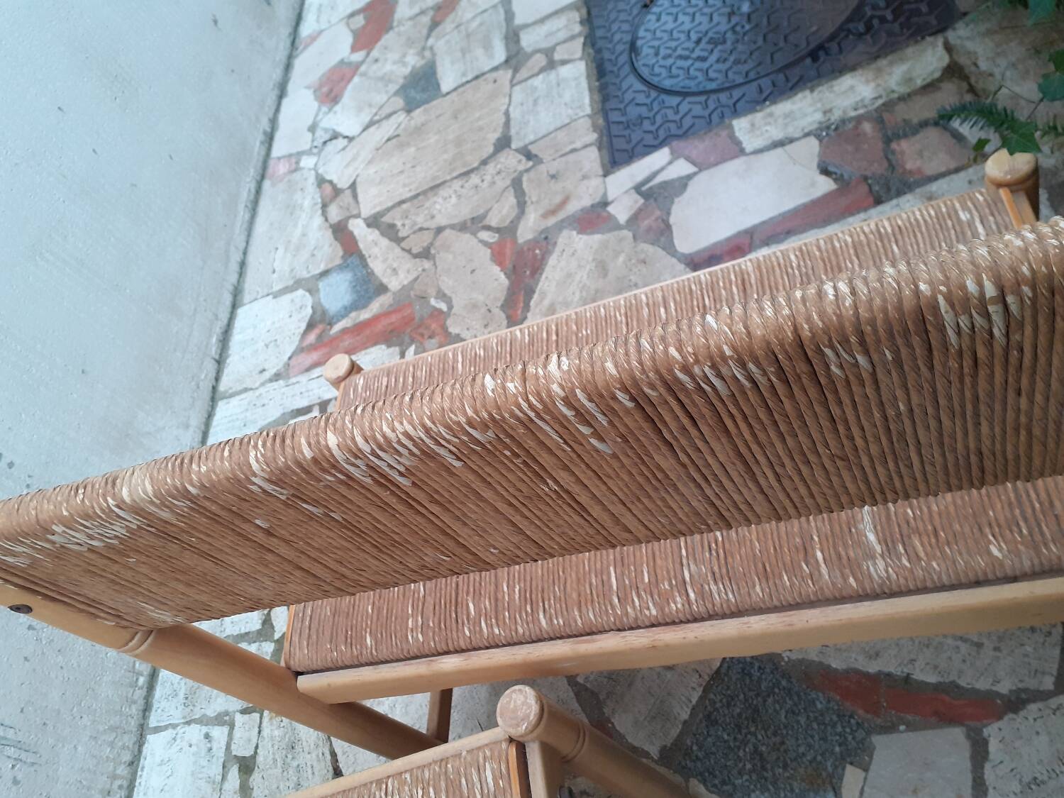 2 wooden and straw benches