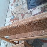 2 wooden and straw benches