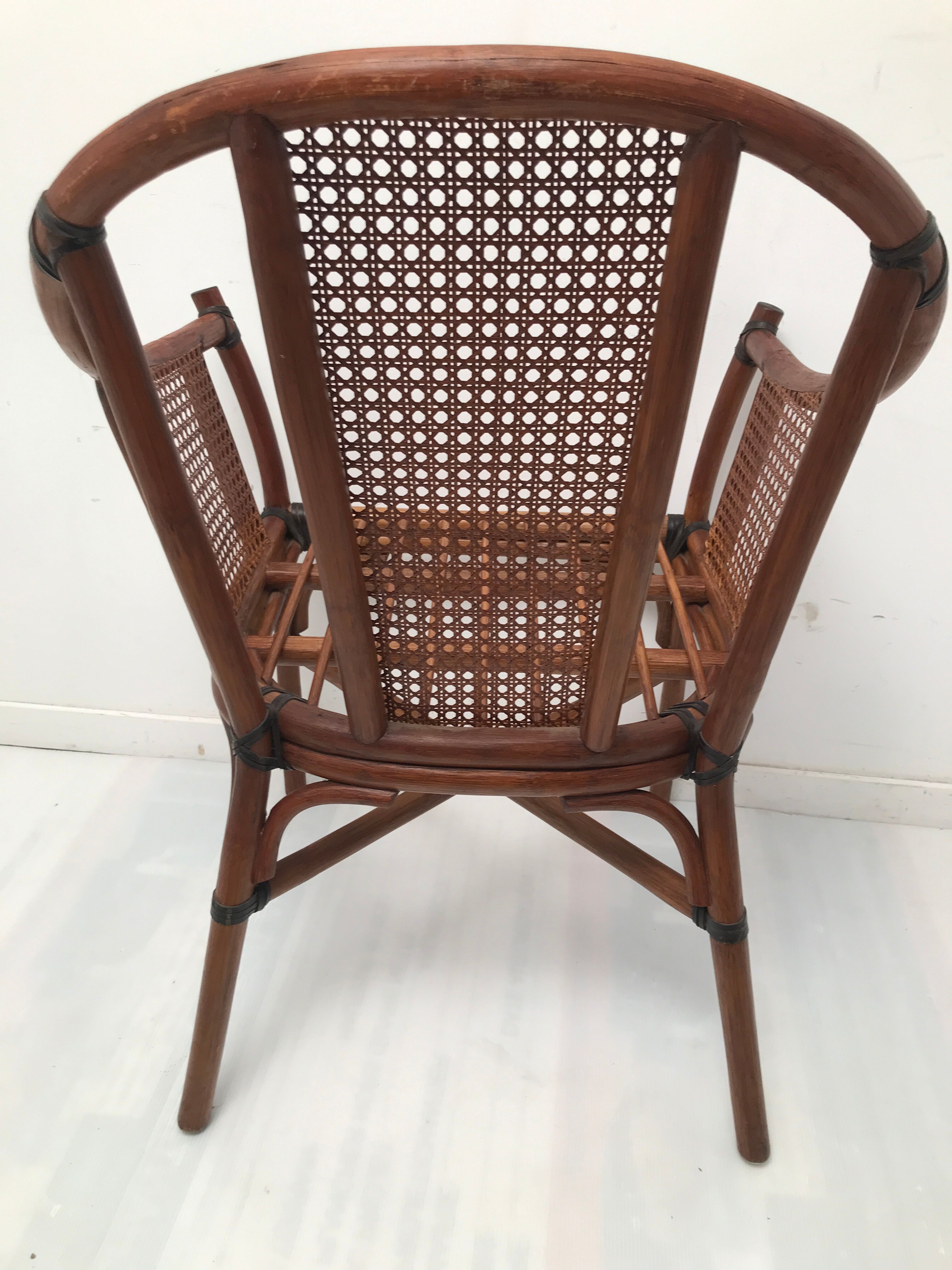 Rattan armchair with its footrest 70s
